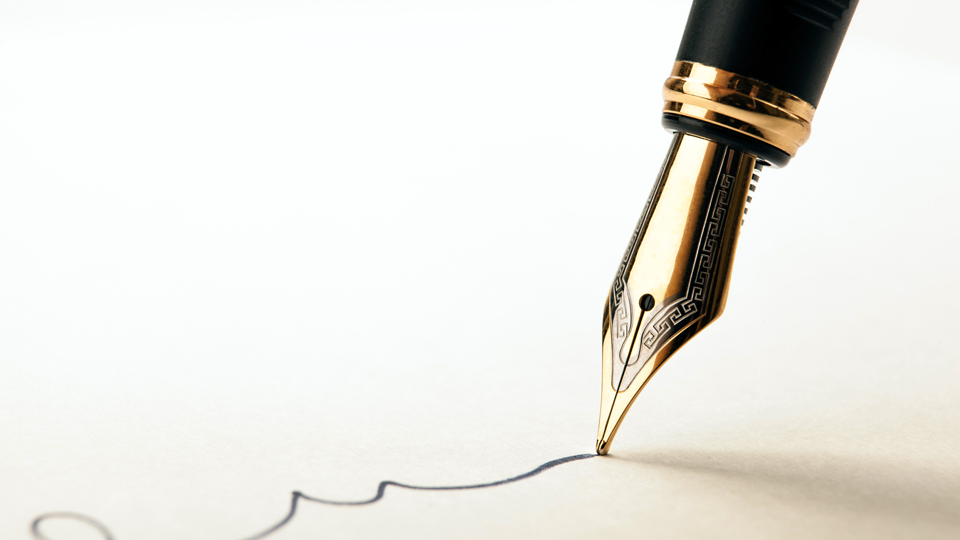 A pen signing a legal document, representing a finalized estate plan